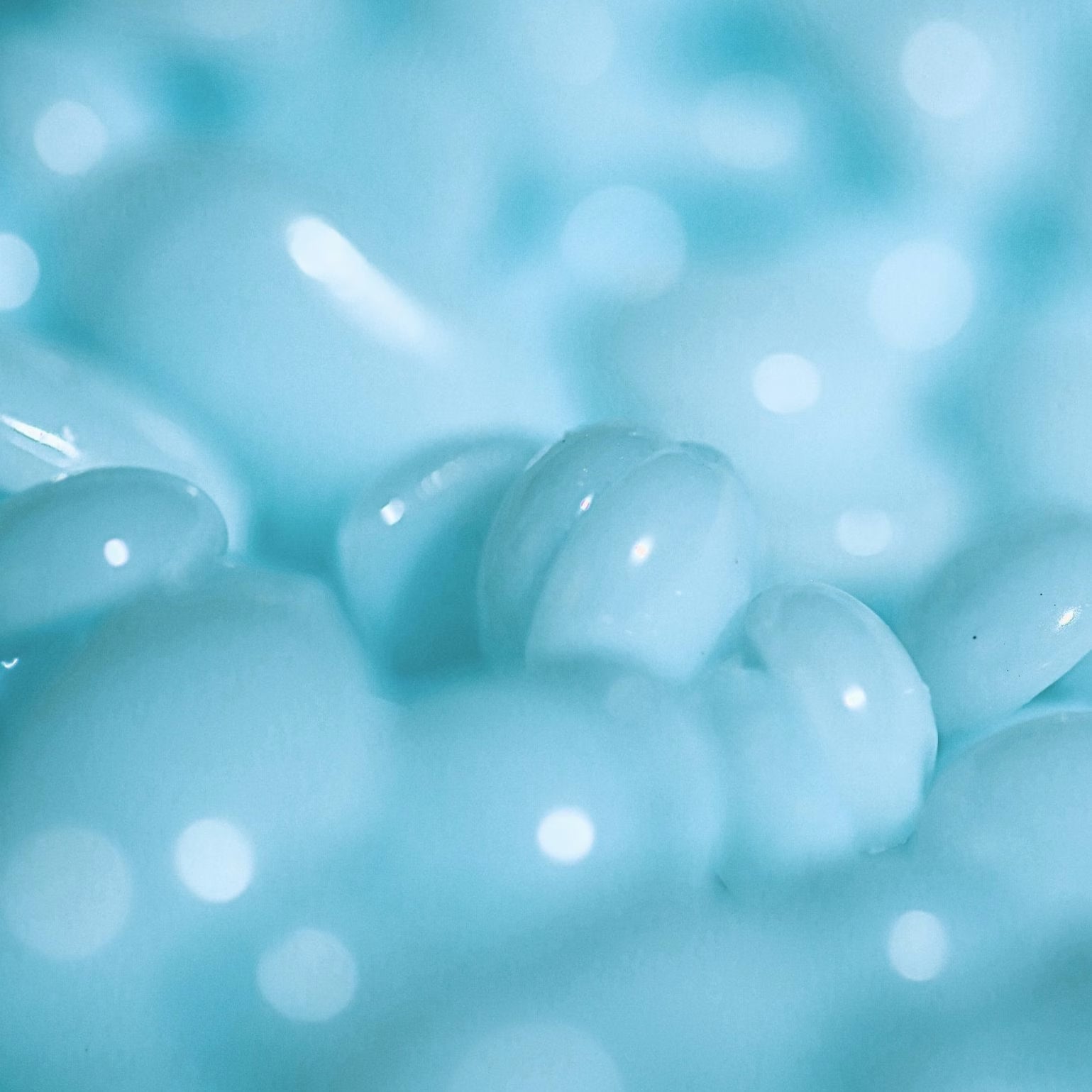 Close-up of light blue melt hard wax Kai from Black Coral Wax