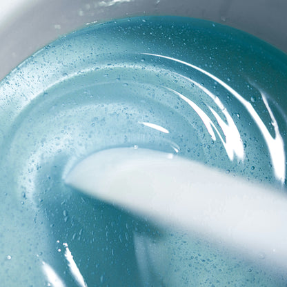 Close-up of a melt hard wax Kai from Black Coral Wax with  spatula 