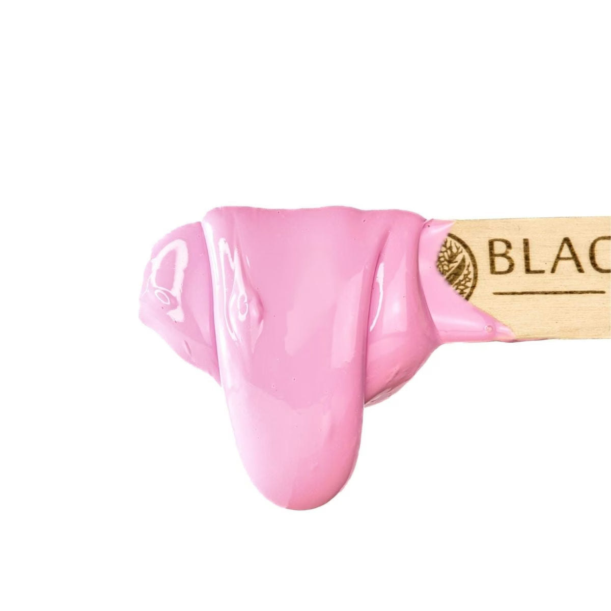 Pink melted hard wax swatch on a wooden spatula with 'Black Coral Wax' branding.